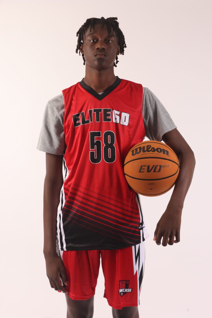 A boy in a red basketball jersey, 58 (2)