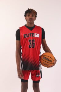 A boy in a red basketball jersey, 36