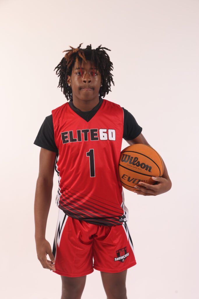 A boy in a red basketball jersey, 1