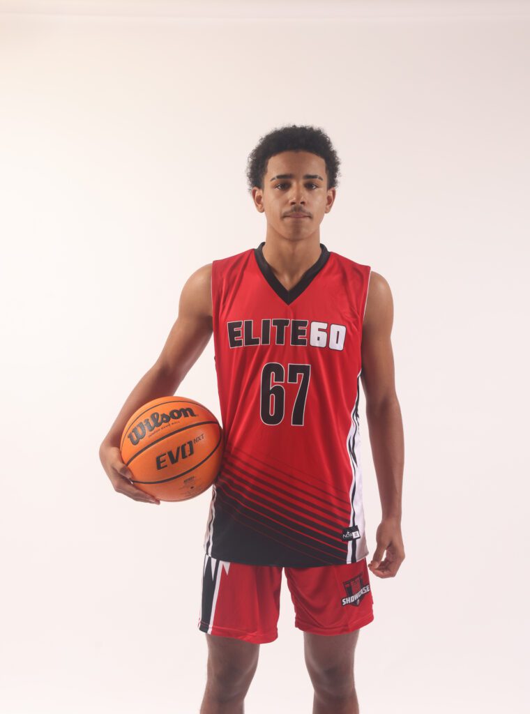 A boy in a red basketball jersey, 67