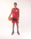 A boy in a red basketball jersey, 09