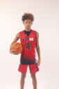 A boy in a red basketball jersey, 18