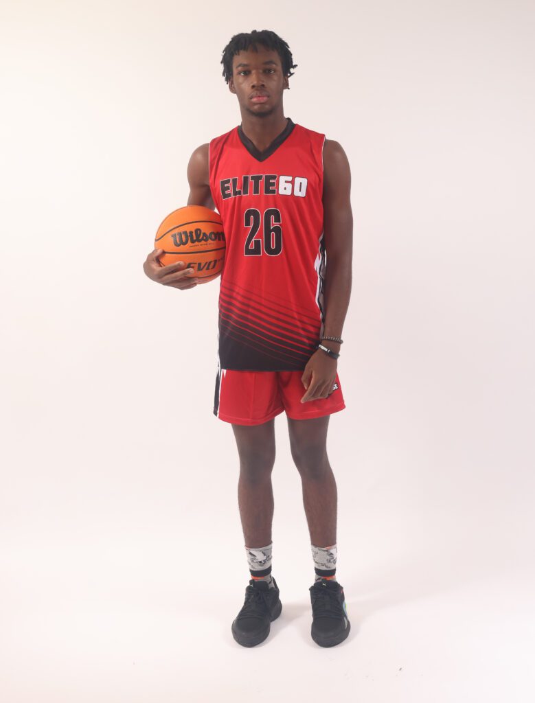 A boy in a red basketball jersey, 25