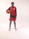 A boy in a red basketball jersey, 8