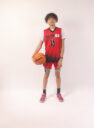 A boy in a red basketball jersey, 15