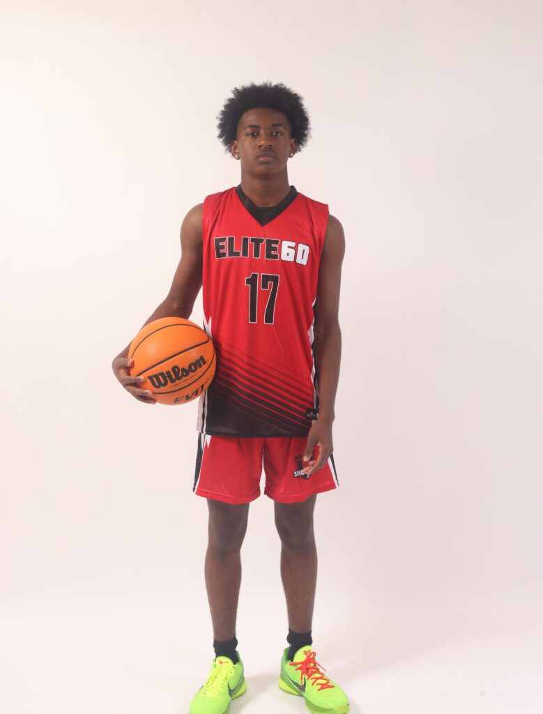 A boy in a red basketball jersey, 17
