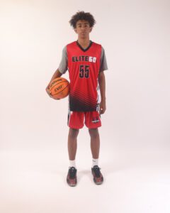A boy in a red basketball jersey, 55