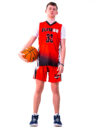 A boy with curly hair in a red basketball jersey holding a ball on his side (5)
