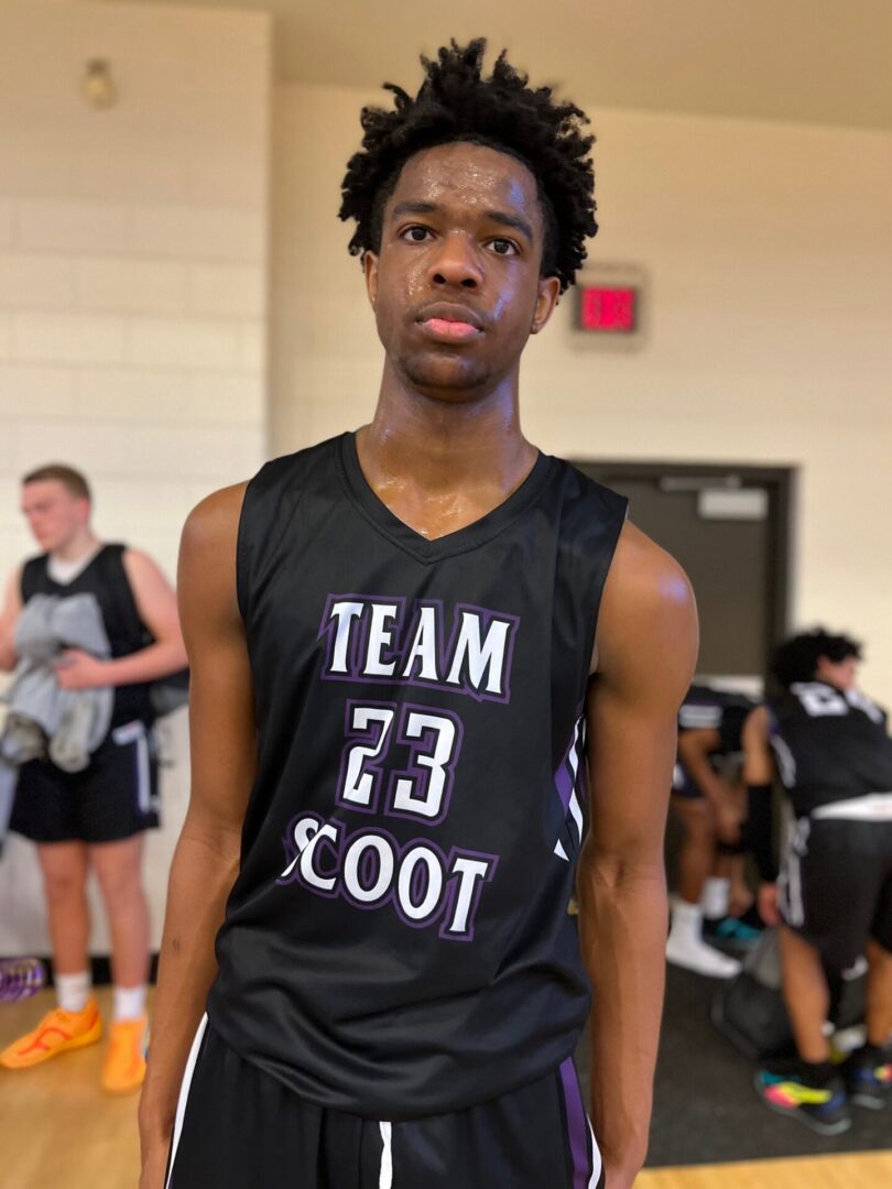 A man wearing team 23 scoot black jersey