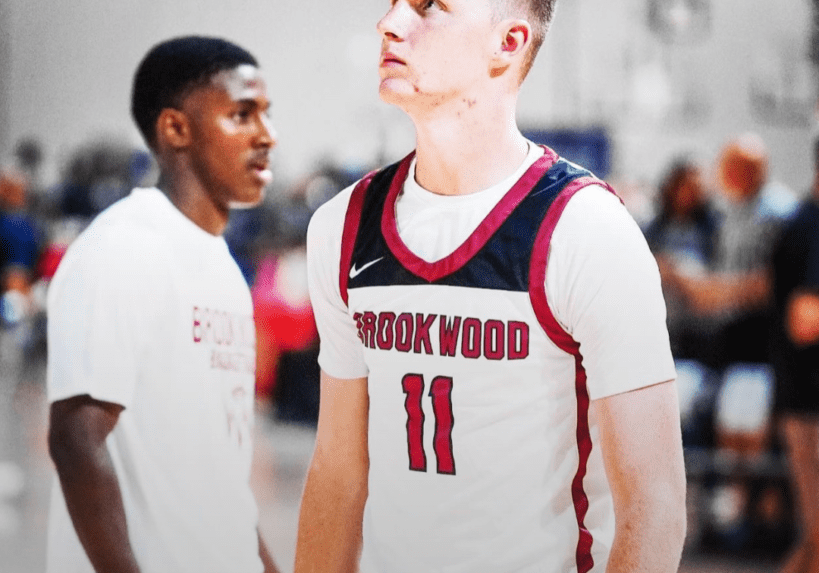 Basketball player in Hookwood jersey focused during the game.