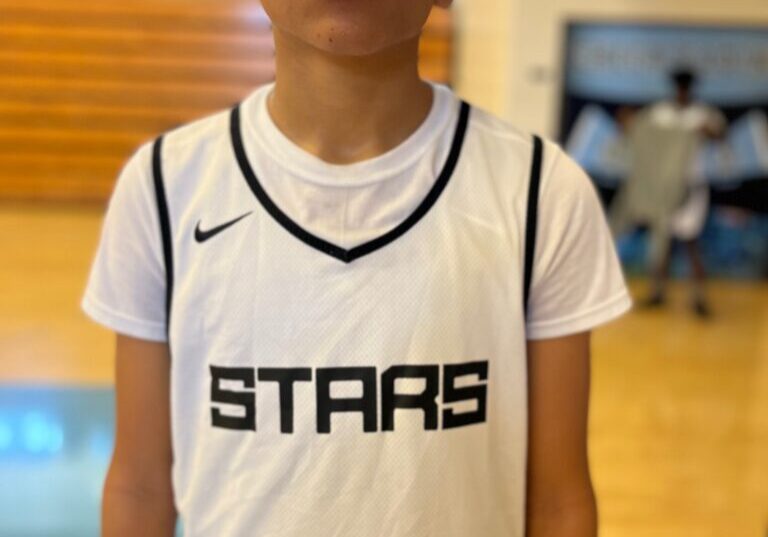 A boy wearing stars white jersey