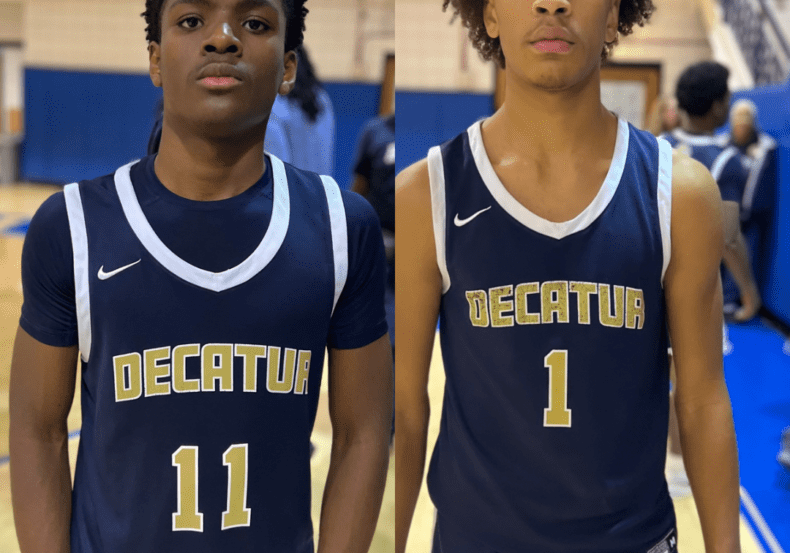 Two basketball players in Decatur jerseys stand side by side.