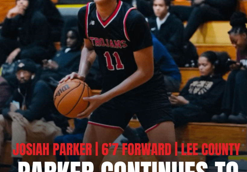 Josiah Parker in action during a basketball game, dribbling the ball.